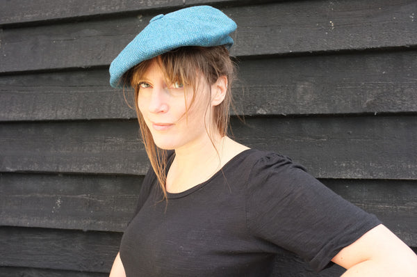 Lady Wearing a Blue Flat Tweed Cap